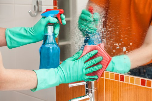 Office cleaning team working in a Kennington workplace reception area